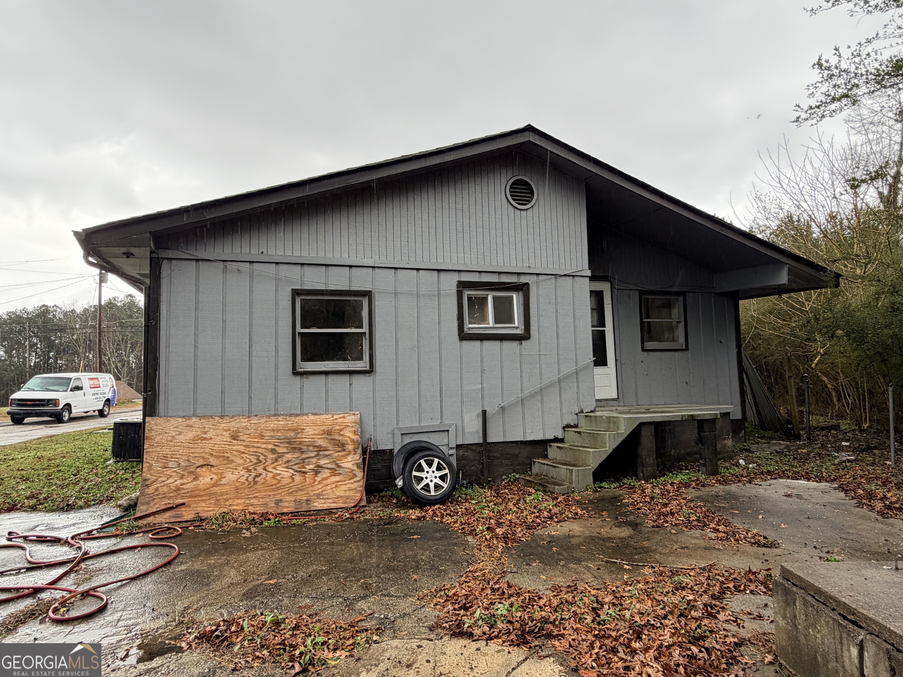 1966 Lake Rockaway Road Northwest Conyers, GA 30012 - Photo 24 of 24 a front view of a house with a yard
