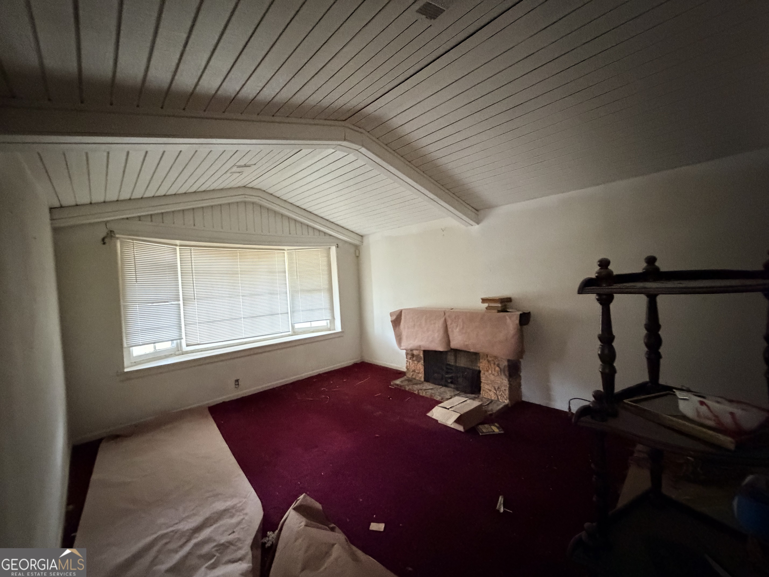 1966 Lake Rockaway Road Northwest Conyers, GA 30012 - Photo 7 of 24 a living room with furniture a window and a chandelier