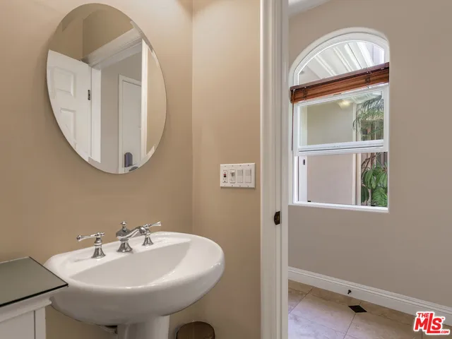 a bed room with a bed and a television