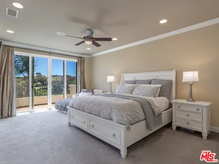 a bathroom with a tub shower and sink