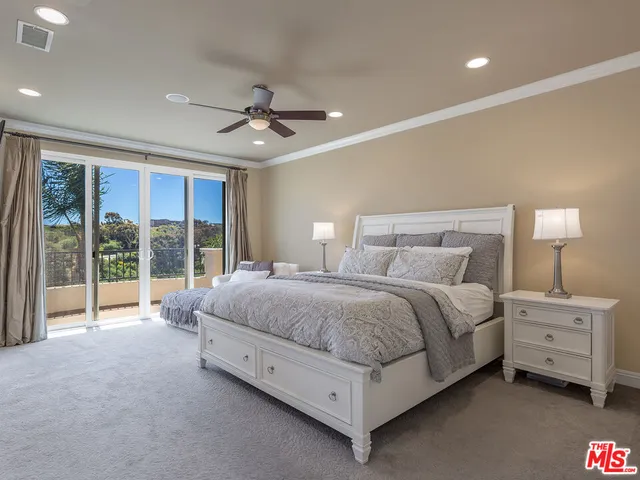 a bathroom with a tub shower and sink