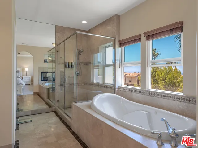 a room with furniture a rug and a window