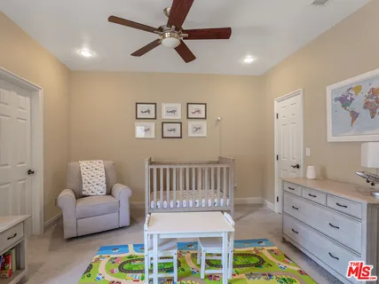 a view of a patio with couches and potted plants