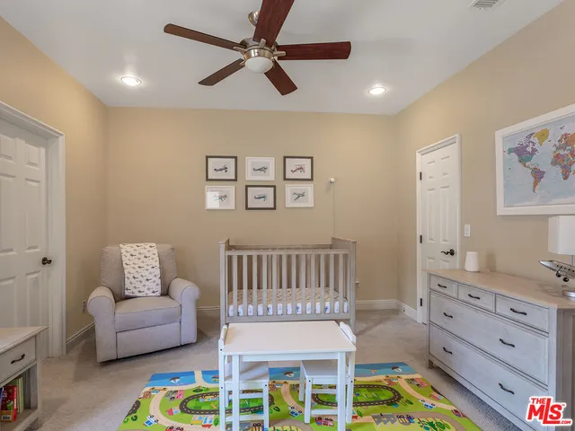 a view of a patio with couches and potted plants
