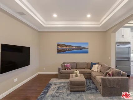 a bathroom with a sink a mirror and a window