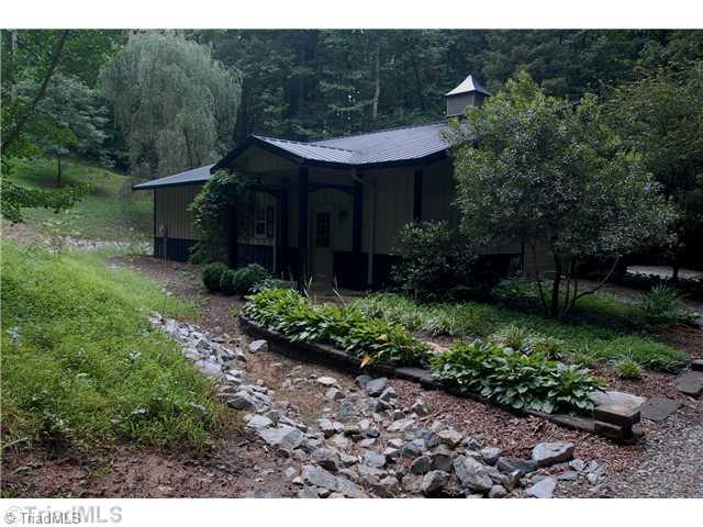 8262 Ballard Road Colfax, NC 27235 - Photo 16 of 16 Outbuilding. Large (43 x 32 ) heated heated storage building with overhead door entrance and covered shed would be ideal for the car collector or for large parties