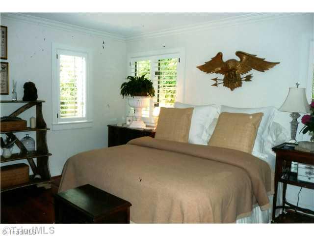 8262 Ballard Road Colfax, NC 27235 - Photo 10 of 16 2nd Bedroom. Second bedroom on the main level has adjoining bath and shower