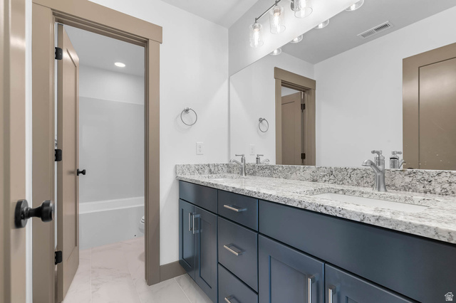 2724 Mt Jordan Road Sandy, UT 84092 - Photo 24 of 33 Full bathroom featuring double vanity, shower / washtub combination, and light marble finish floors