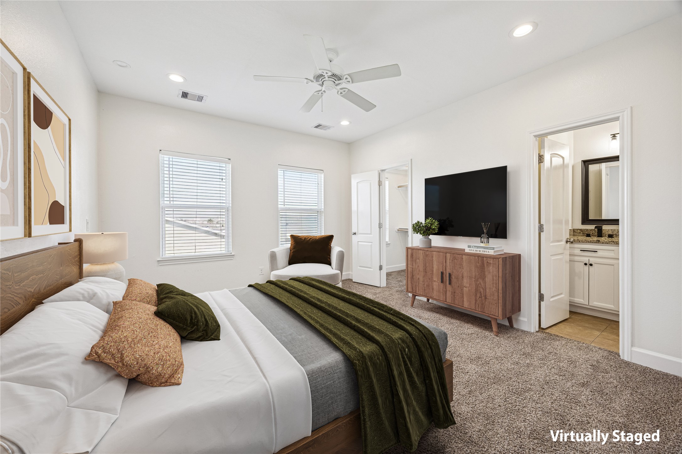 5402 Jonathan Lane Houston, TX 77011 - Photo 14 of 33 a bedroom with a bed and a flat screen tv