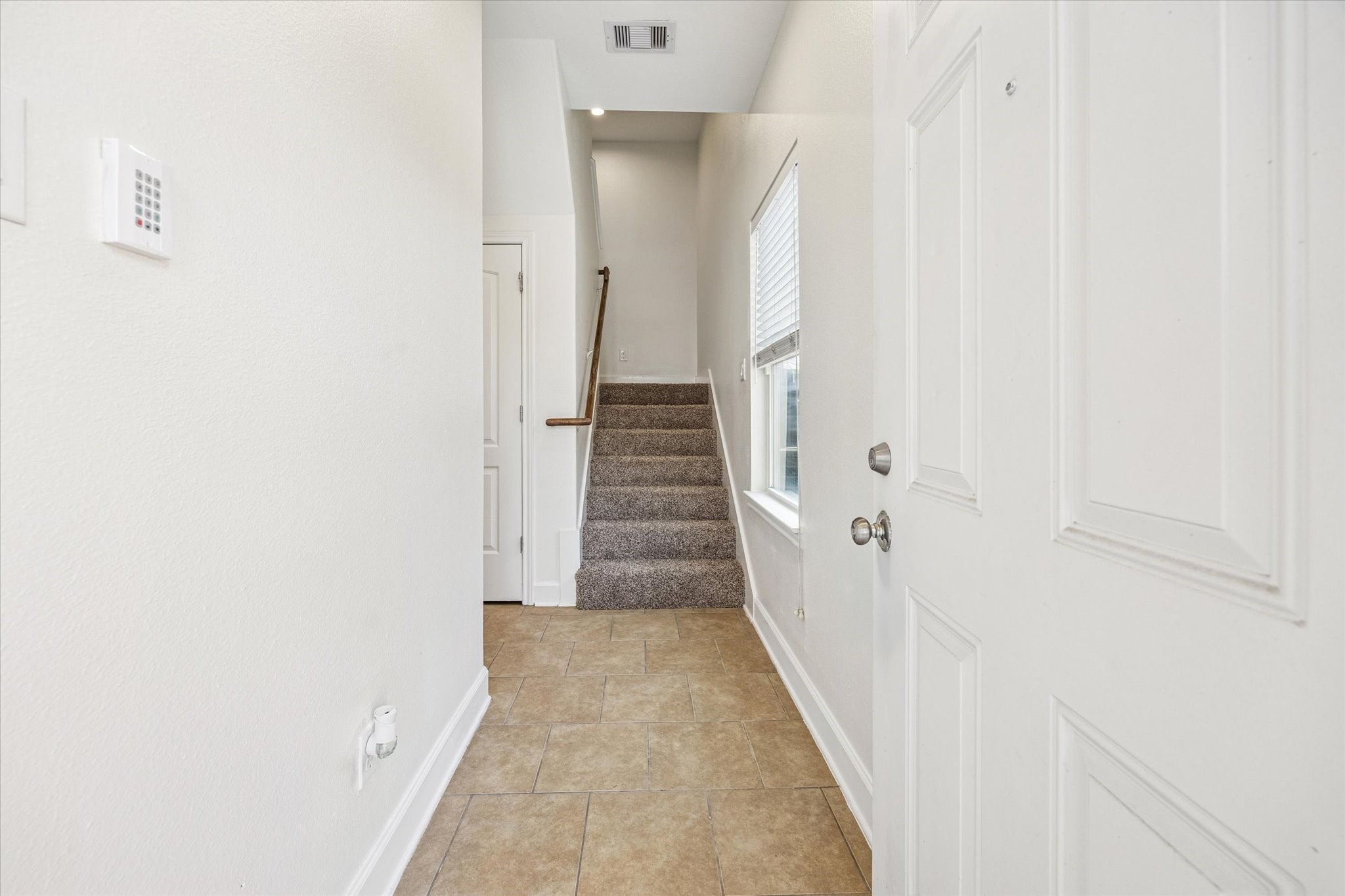 5402 Jonathan Lane Houston, TX 77011 - Photo 30 of 33 a view of a hallway with white walls