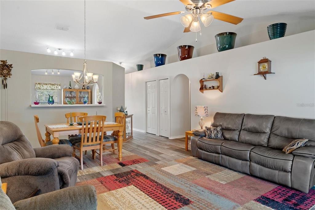 12255 Linden Drive Spring Hill, FL 34608 - Photo 11 of 26 a living room with furniture and a chandelier