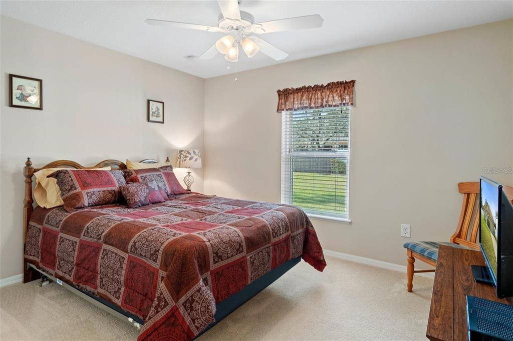 12255 Linden Drive Spring Hill, FL 34608 - Photo 15 of 26 a bedroom with bed and a window