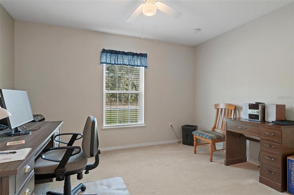 12255 Linden Drive Spring Hill, FL 34608 - Photo 20 of 26 a view of a workspace with furniture and a window