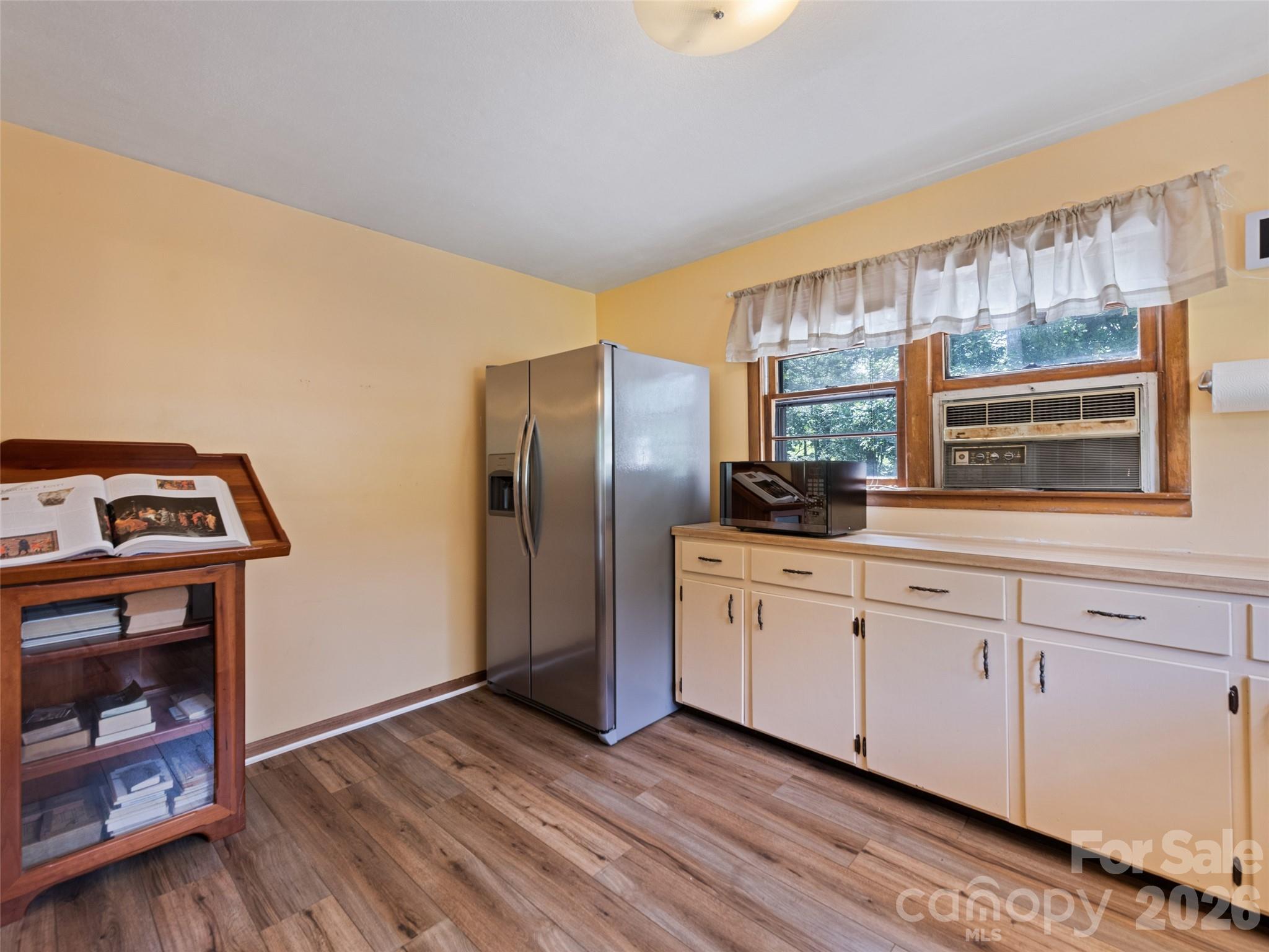 1714 Iron Duff Road Waynesville, NC 28785 - Photo 13 of 25 a kitchen with stainless steel appliances granite countertop a refrigerator and a stove top oven