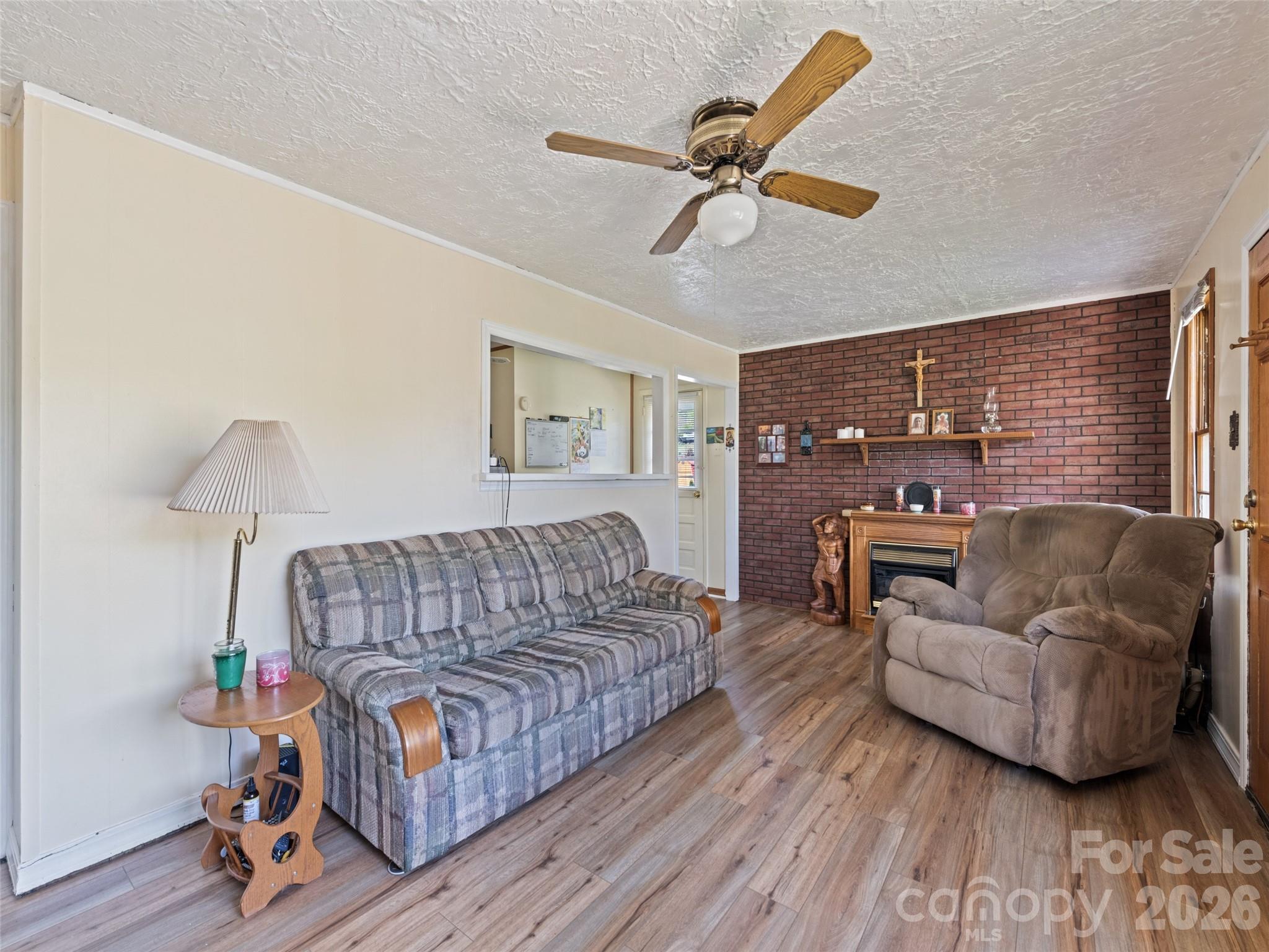 1714 Iron Duff Road Waynesville, NC 28785 - Photo 17 of 25 a living room with furniture and a wooden floor