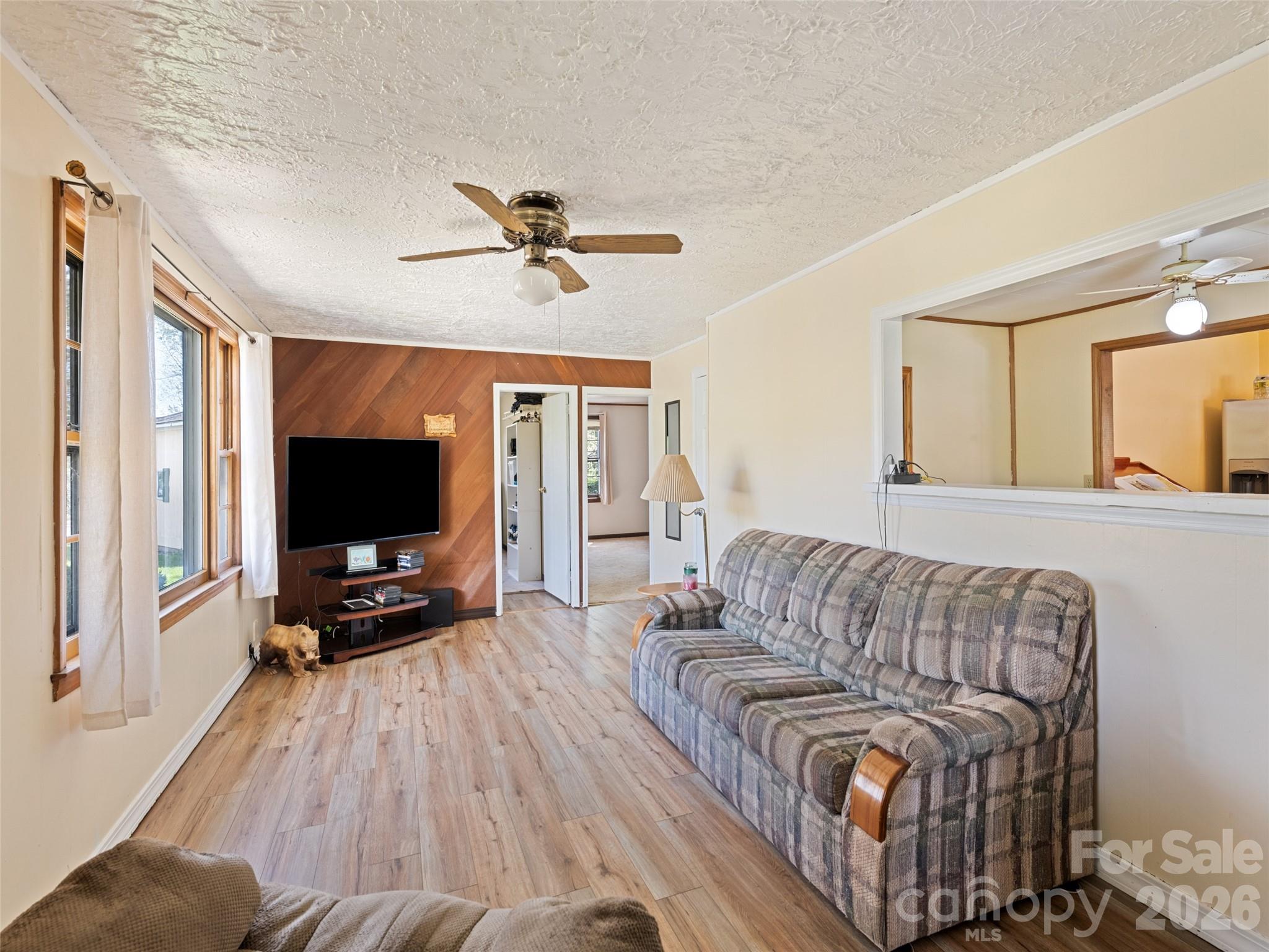 1714 Iron Duff Road Waynesville, NC 28785 - Photo 18 of 25 a living room with furniture and a flat screen tv