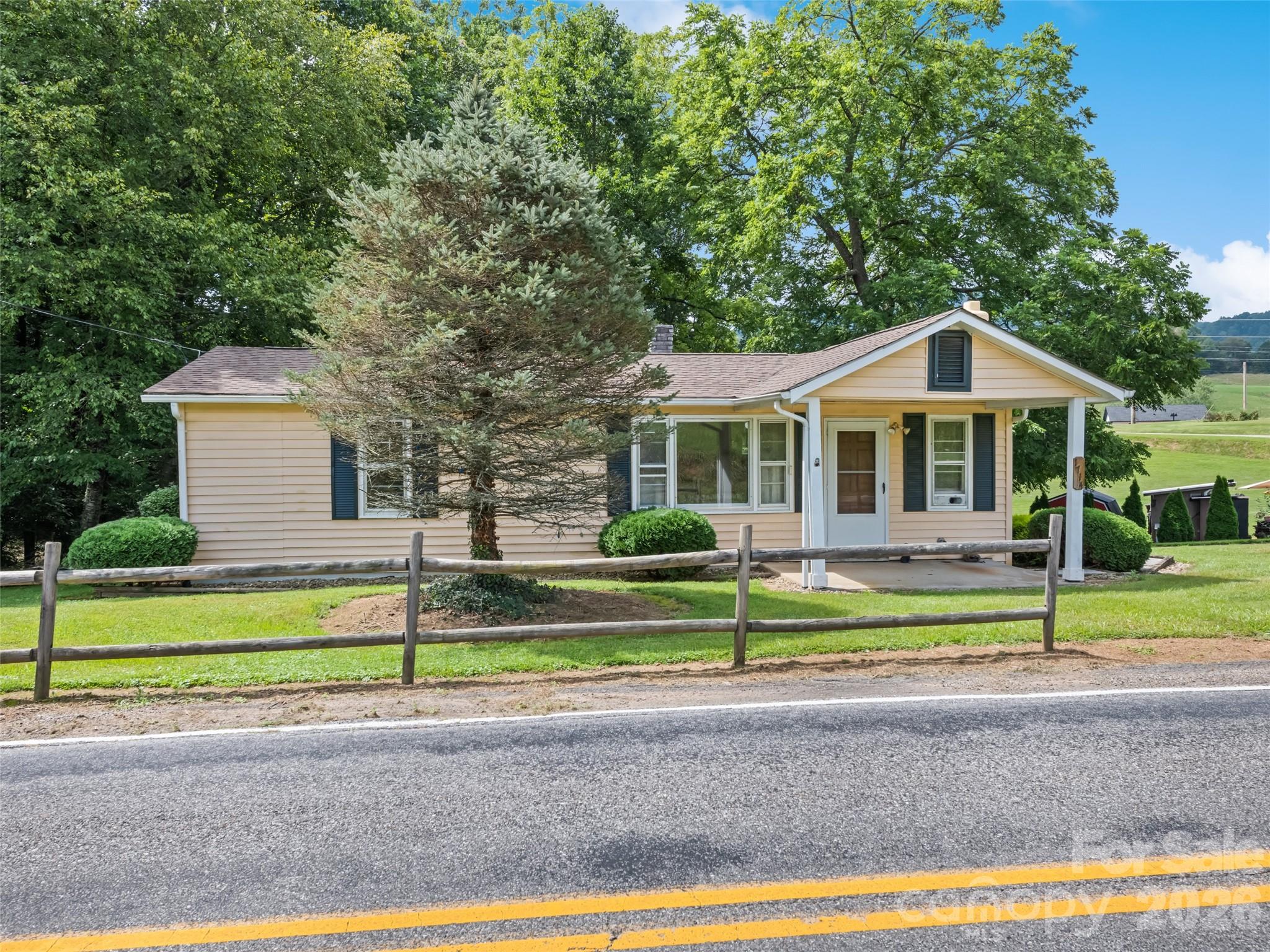1714 Iron Duff Road Waynesville, NC 28785 - Photo 2 of 25 a front view of a house with a yard