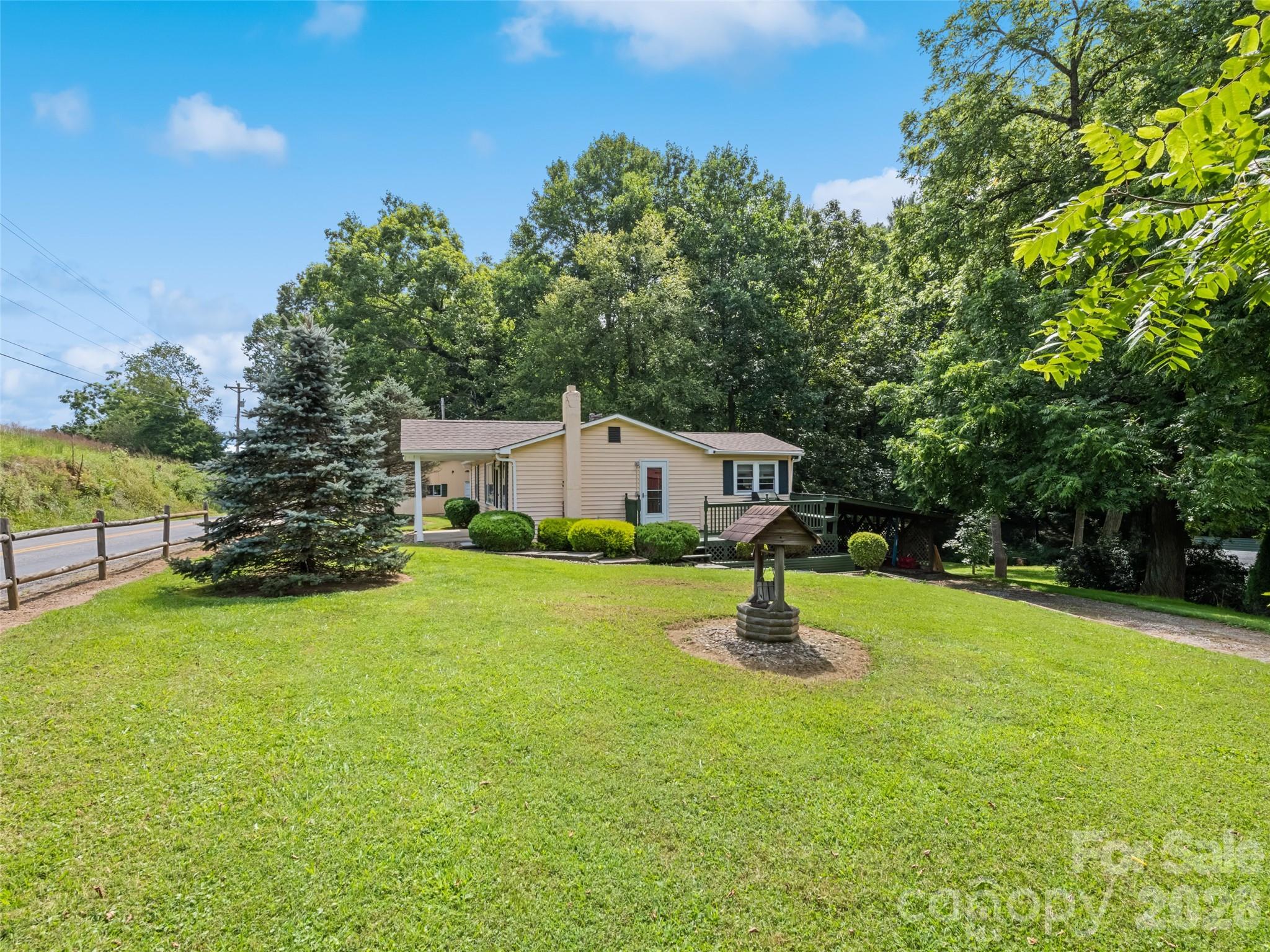 1714 Iron Duff Road Waynesville, NC 28785 - Photo 5 of 25 a swimming pool with outdoor seating and yard