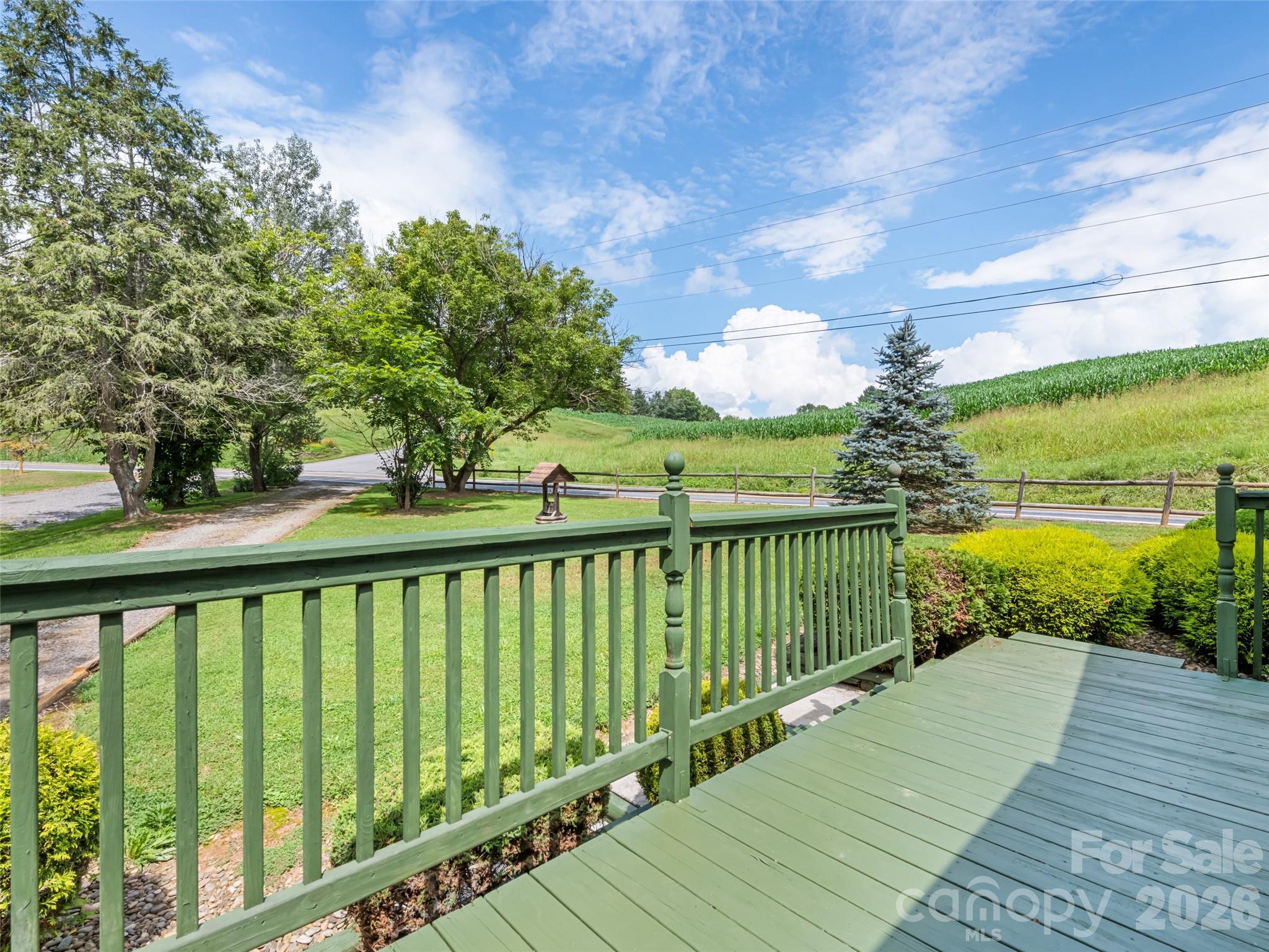 1714 Iron Duff Road Waynesville, NC 28785 - Photo 9 of 25 a view of a balcony with wooden floor & fence