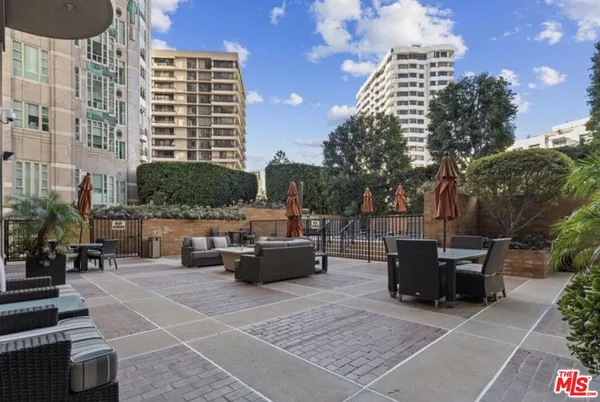a view of outdoor space with seating area and barbeque oven