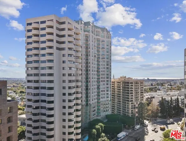 a view of a city with tall buildings