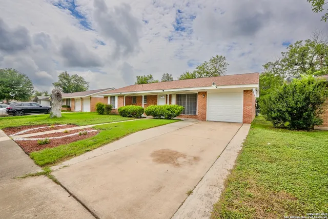 a house with garden in front of it