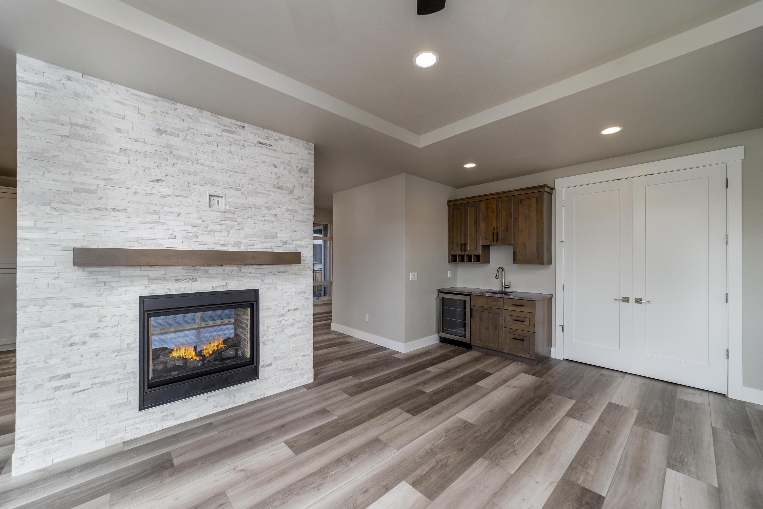 3679 Southwest 45th Street Redmond, OR 97756 - Photo 14 of 41 The double sided fireplace has entertainment hookups on each side.