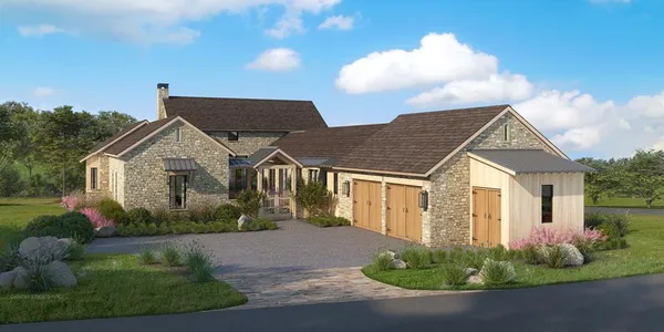 a view of a white house next to a yard with potted plants