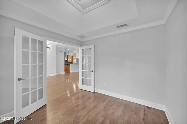 an empty room with walk in closet and window