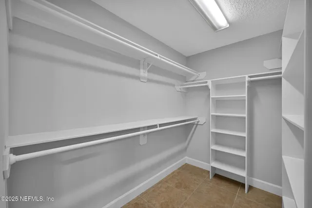 a view of an empty walk in closet