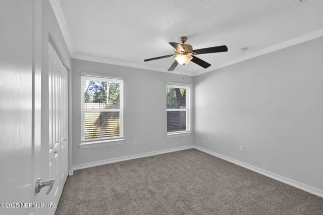 a view of empty room with windows