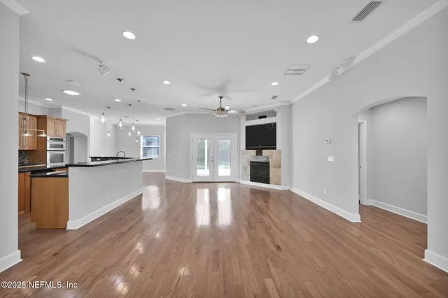 a view of kitchen with a sink refrigerator and window