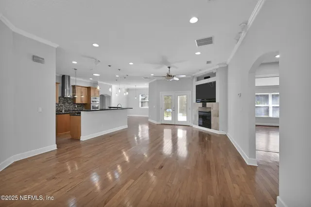 a view of kitchen with kitchen island and stainless steel appliances