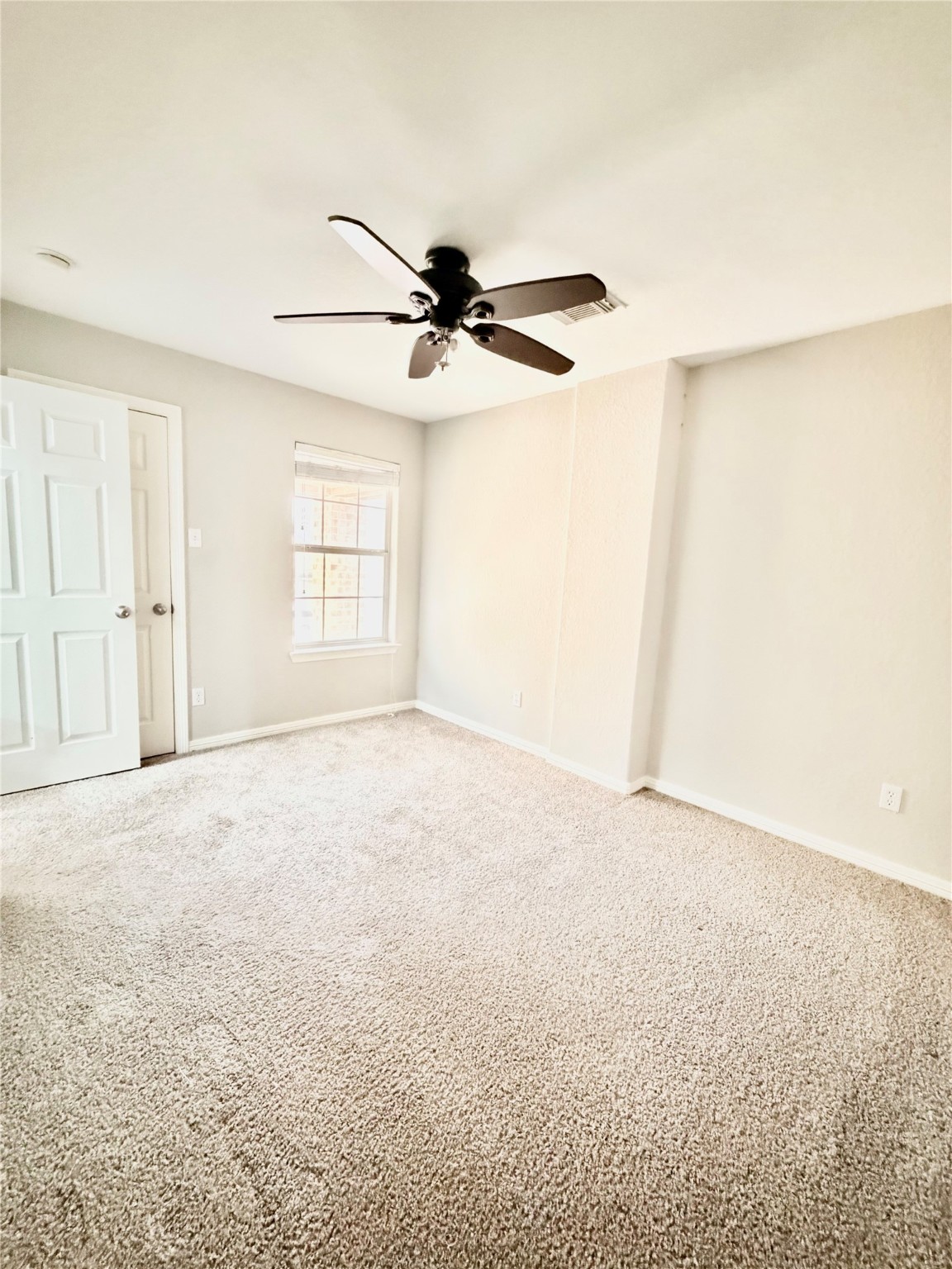9110 Grandview Park Drive Spring, TX 77379 - Photo 11 of 28 an empty room with windows and fan