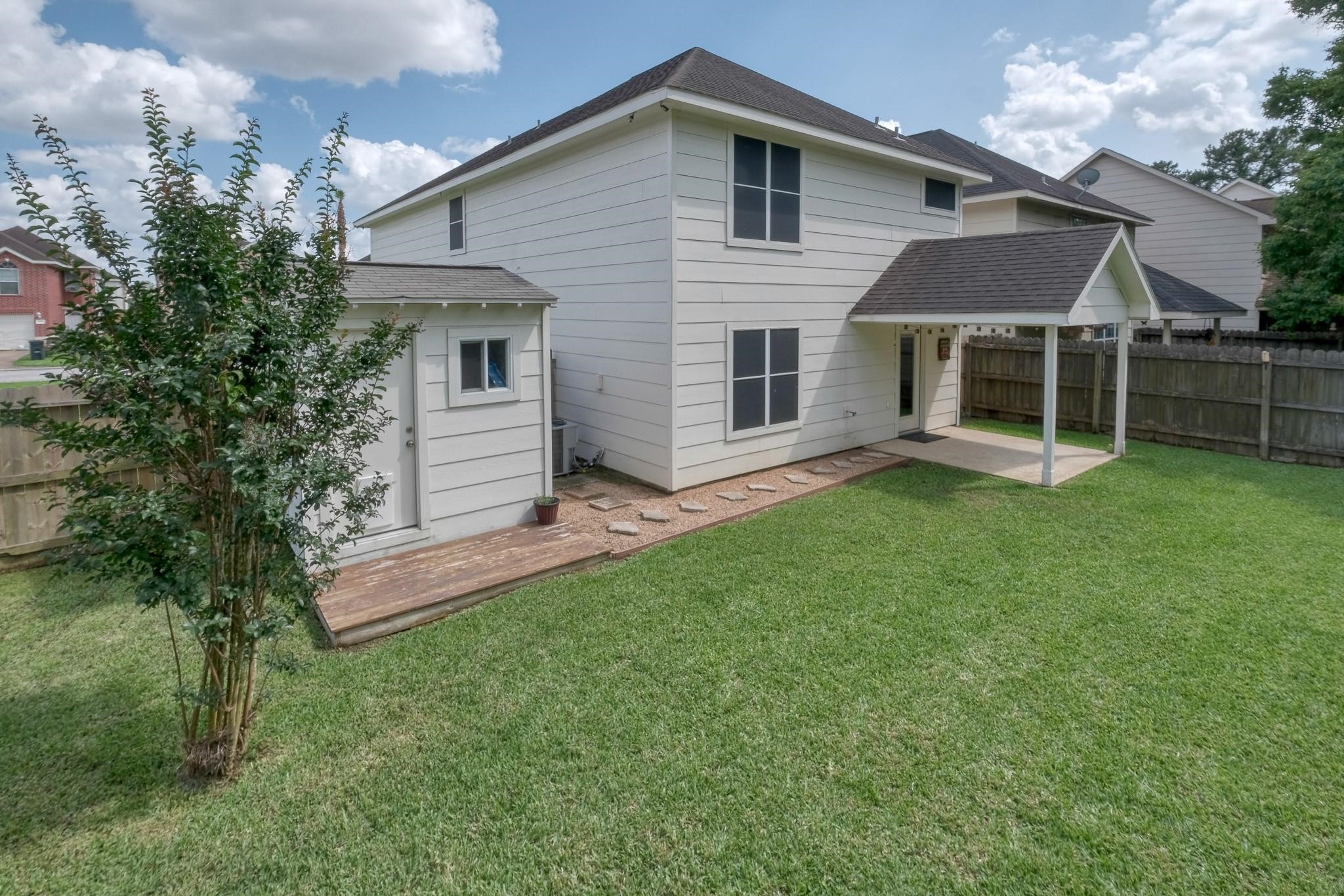 9110 Grandview Park Drive Spring, TX 77379 - Photo 27 of 28 a view of a house with a yard and sitting area