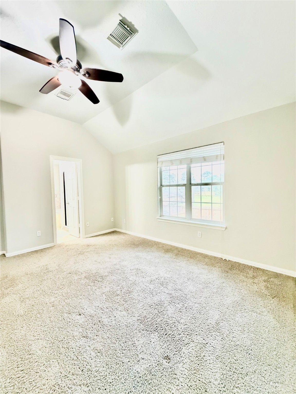 9110 Grandview Park Drive Spring, TX 77379 - Photo 5 of 28 en empty room with windows and ceiling fan