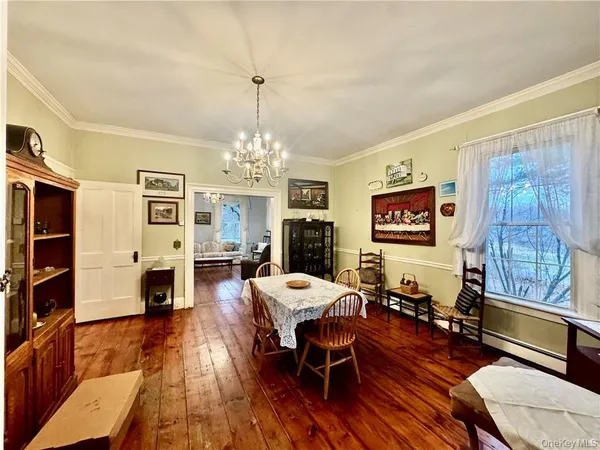 a living room with furniture a fireplace and a window