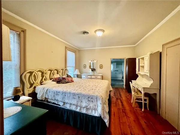 a bedroom with a bed and a table in it