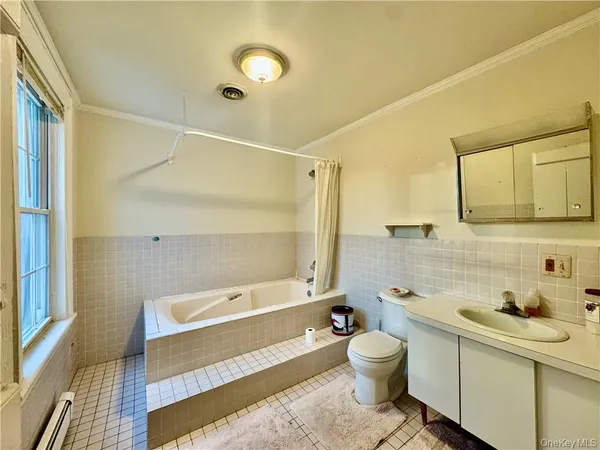 a bathroom with a toilet a sink and a bathtub