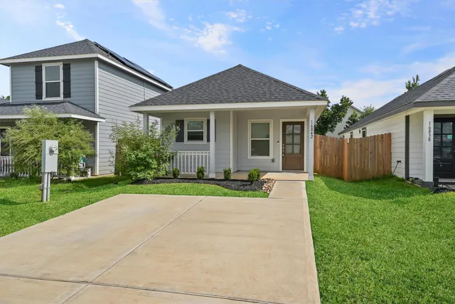 front view of a house and a yard