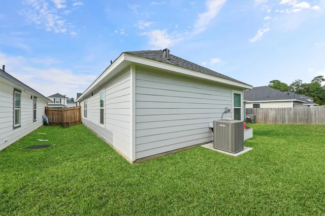 a backyard of a house with lots of green space