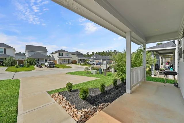 a front view of a house with garden and porch