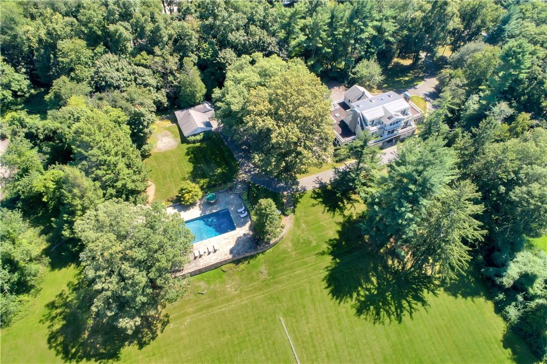 Welcome to 13 Tavano Road.  This private oasis boasts, swimming pool and pool house, stocked pond,  5 car garages, 3 horse stables on 4.5 magnificent acres.