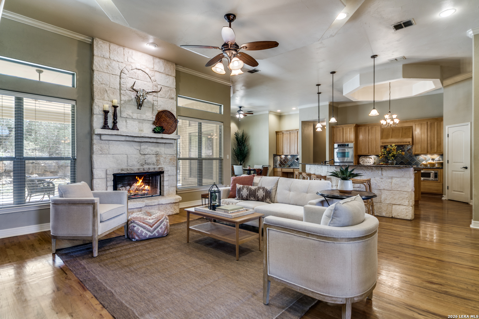 a living room with furniture and a fireplace