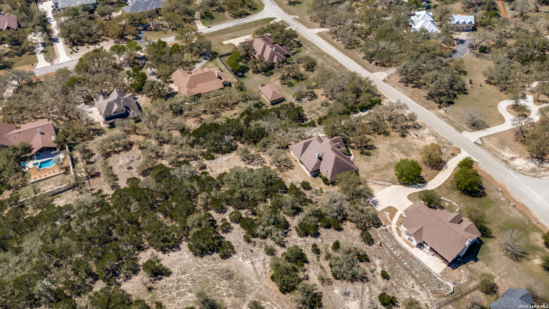 386 Wentworth Spring Branch, TX 78070 - Photo 28 of 30 an aerial view of a house with a yard