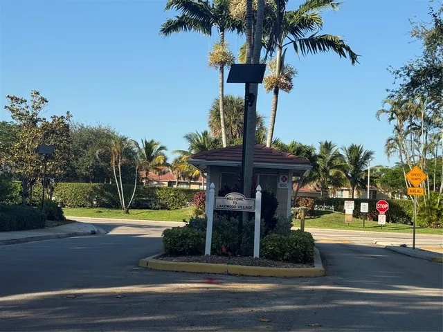 a front view of a house with fountain and entertaining space