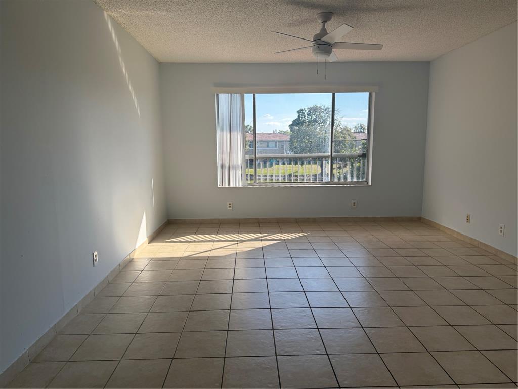 9930 Twin Lakes Drive, Unit 7L Coral Springs, FL 33071 - Photo 11 of 39 a view of an empty room with a window