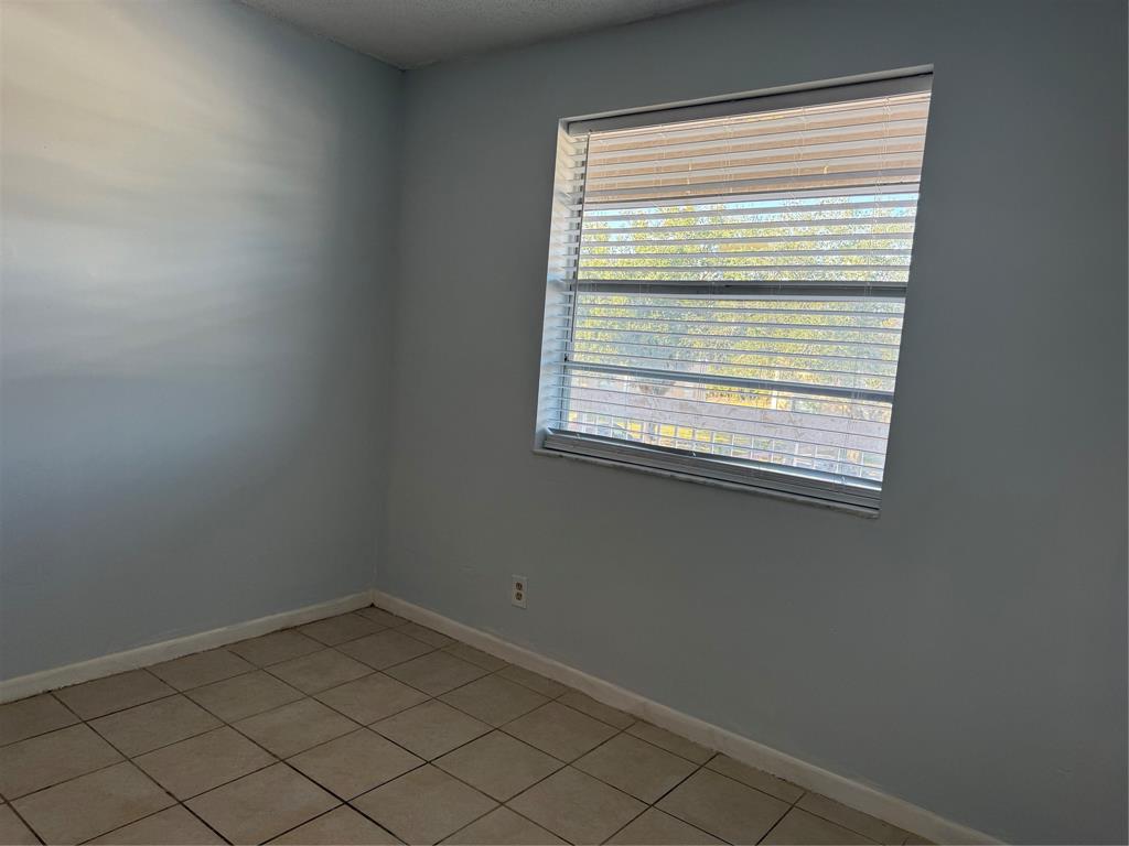 9930 Twin Lakes Drive, Unit 7L Coral Springs, FL 33071 - Photo 31 of 39 a view of a room that has a window in it