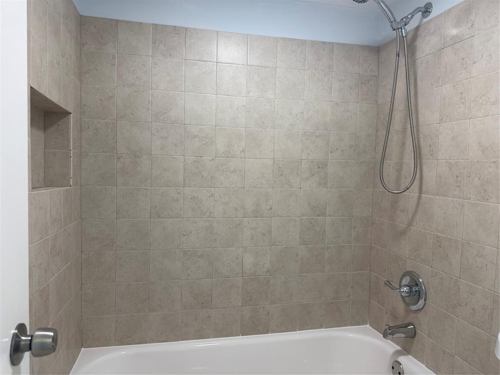 9930 Twin Lakes Drive, Unit 7L Coral Springs, FL 33071 - Photo 34 of 39 a bathroom with a bathtub