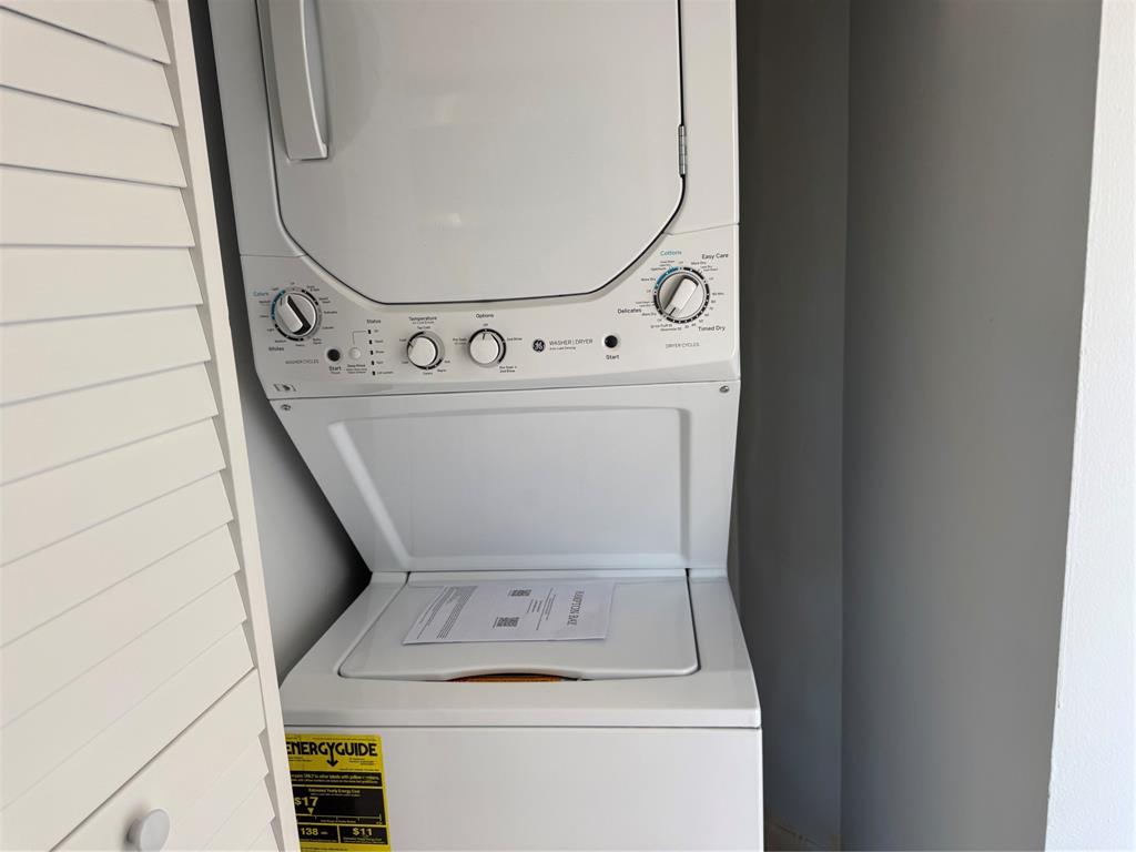 9930 Twin Lakes Drive, Unit 7L Coral Springs, FL 33071 - Photo 9 of 39 a utility room with dryer and washer